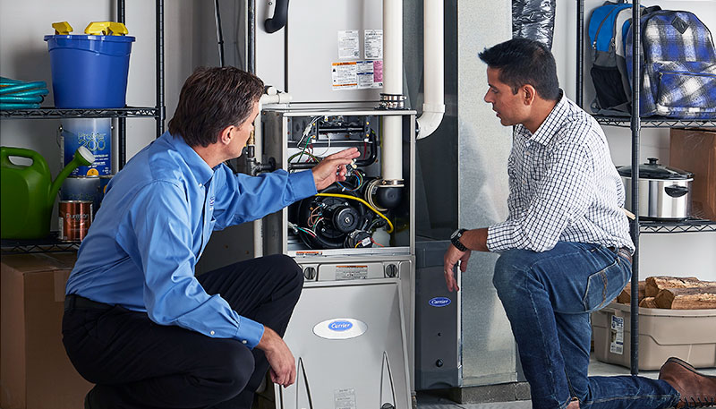 HVAC technician evaluating a furnace for repair or replacement in Midvale